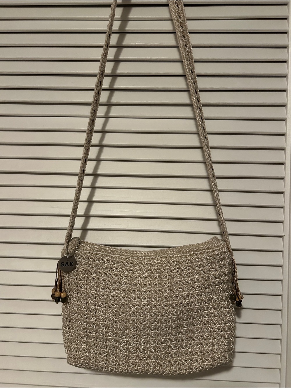 The Sak Natural Woven Crossbody Bag with Bead Tassels